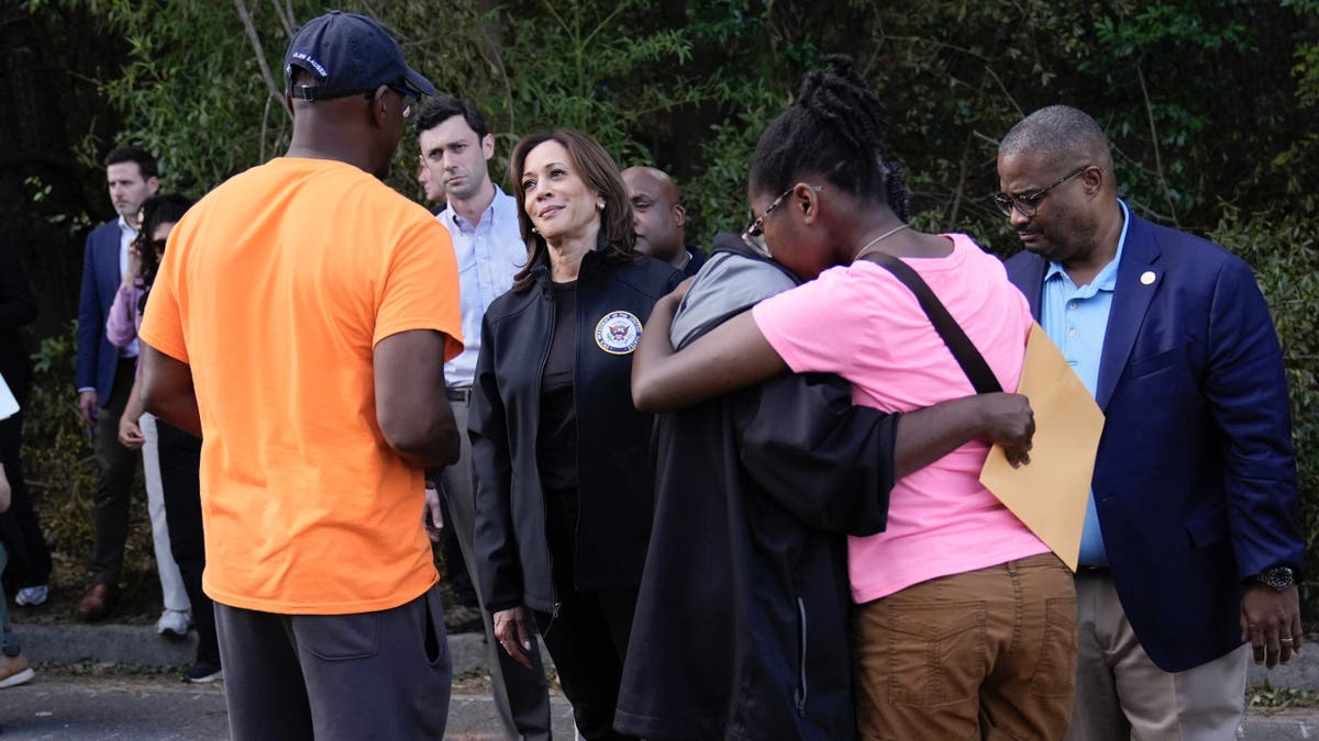 Democratic presidential nominee Vice President Kamala Harris greets people who were impacted by Hurricane Helene in Augusta, Ga., Wednesday, Oct. 2, 2024, as Augusta Mayor Garnett Johnson watches at right. (AP Photo/Carolyn Kaster)