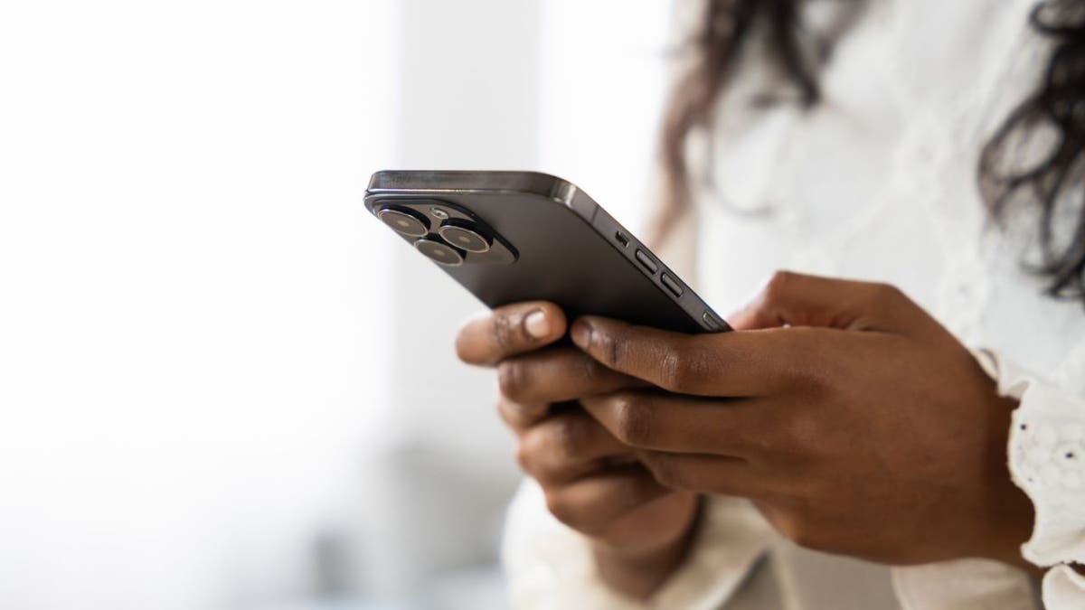 Woman looking at text messages