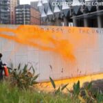 Climate activists spray US embassy in London with orange paint after Trump reelection victory