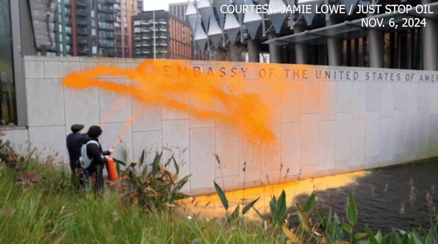 Climate activists cover US embassy in London with orange paint after Trump's projected win