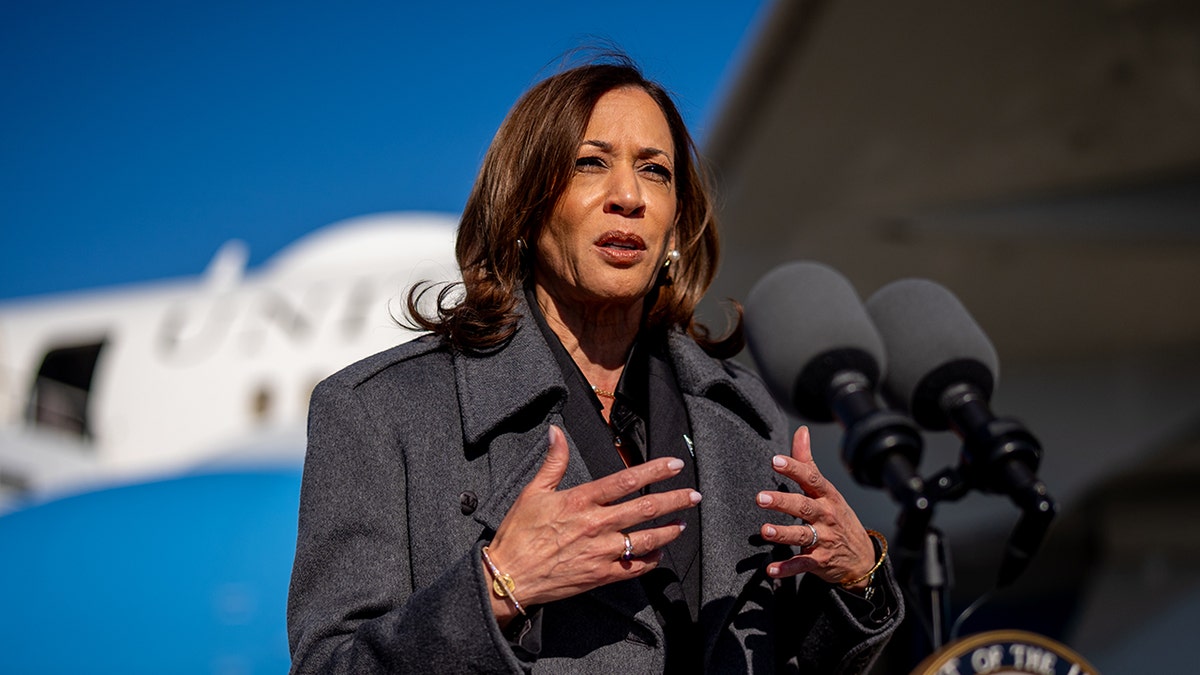 Harris speaks to reporters after getting off Air Force 2