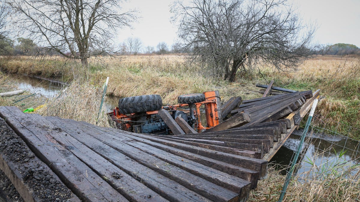 Tractor in creek after bridge collapses