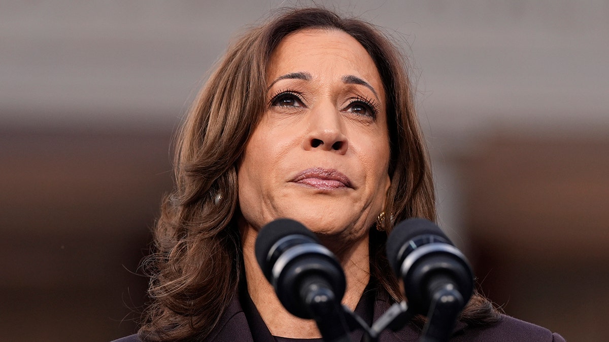 Kamala Harris in front of a microphone