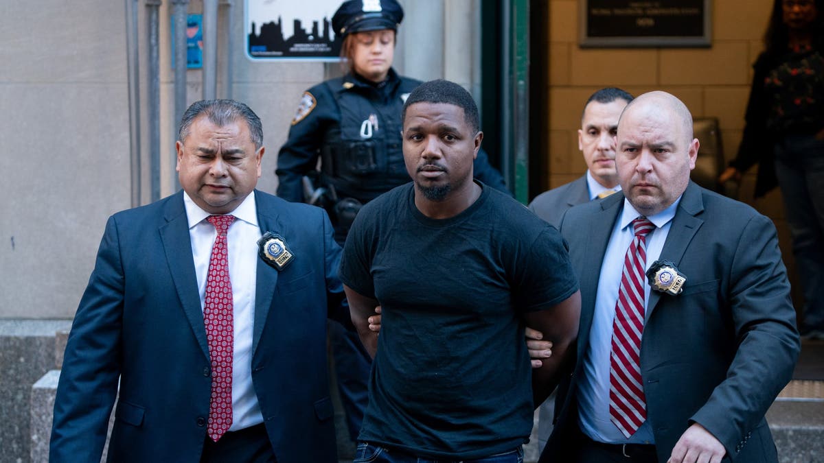 Jaheem Warren doing the perp walk in NYC. 