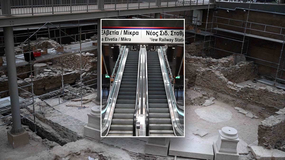 Construction of a metro station in Greece in background on photo showing escalators inside station