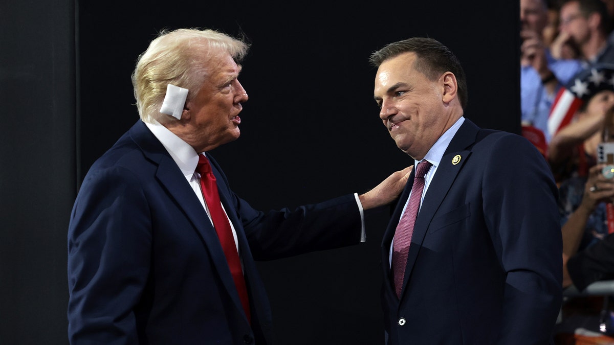 Former President Donald Trump greets Rep. Richard Hudson (R-NC), Chair of the National Republican Congressional Committee (NRCC), on the fourth day of the Republican National Convention at the Fiserv Forum on July 18, 2024, in Milwaukee, Wisconsin.