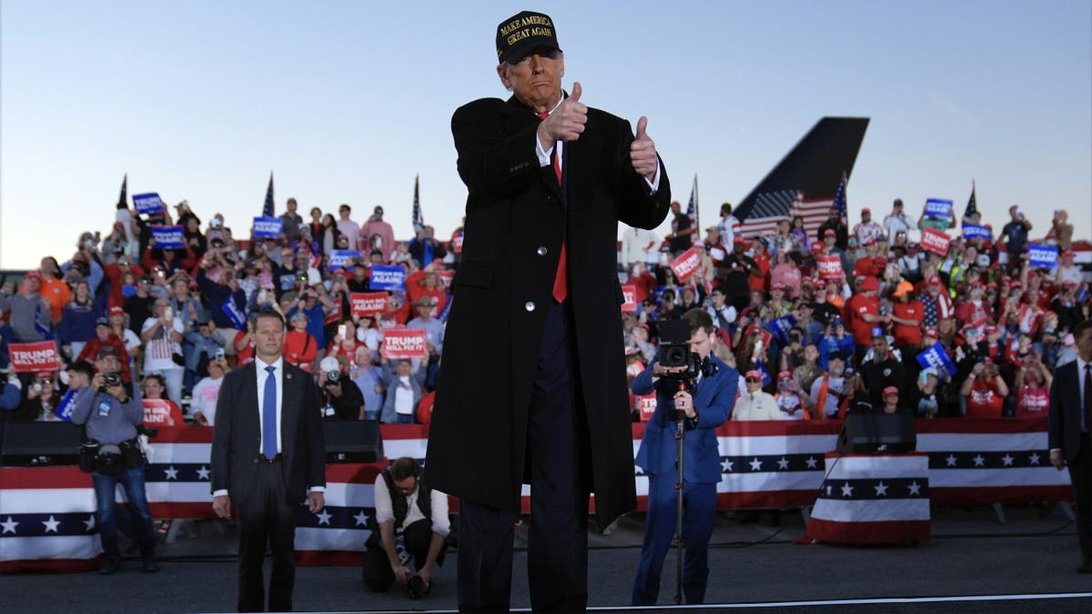 Republican presidential nominee former President Donald Trump gestures at a campaign rally at Kinston Regional Jetport, Sunday, Nov. 3, 2024, in Kinston, N.C. (AP Photo/Evan Vucci)