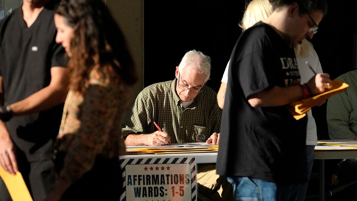 Poll worker and voters in Massachusetts