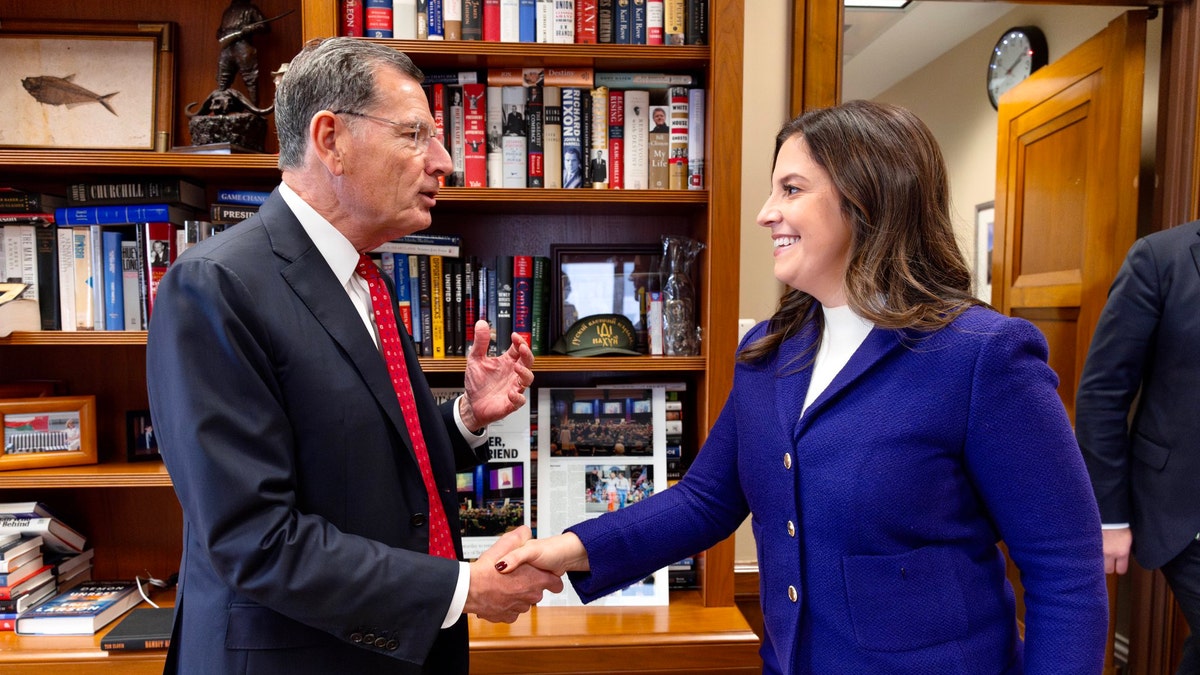 Stefanik and Barasso shake hands