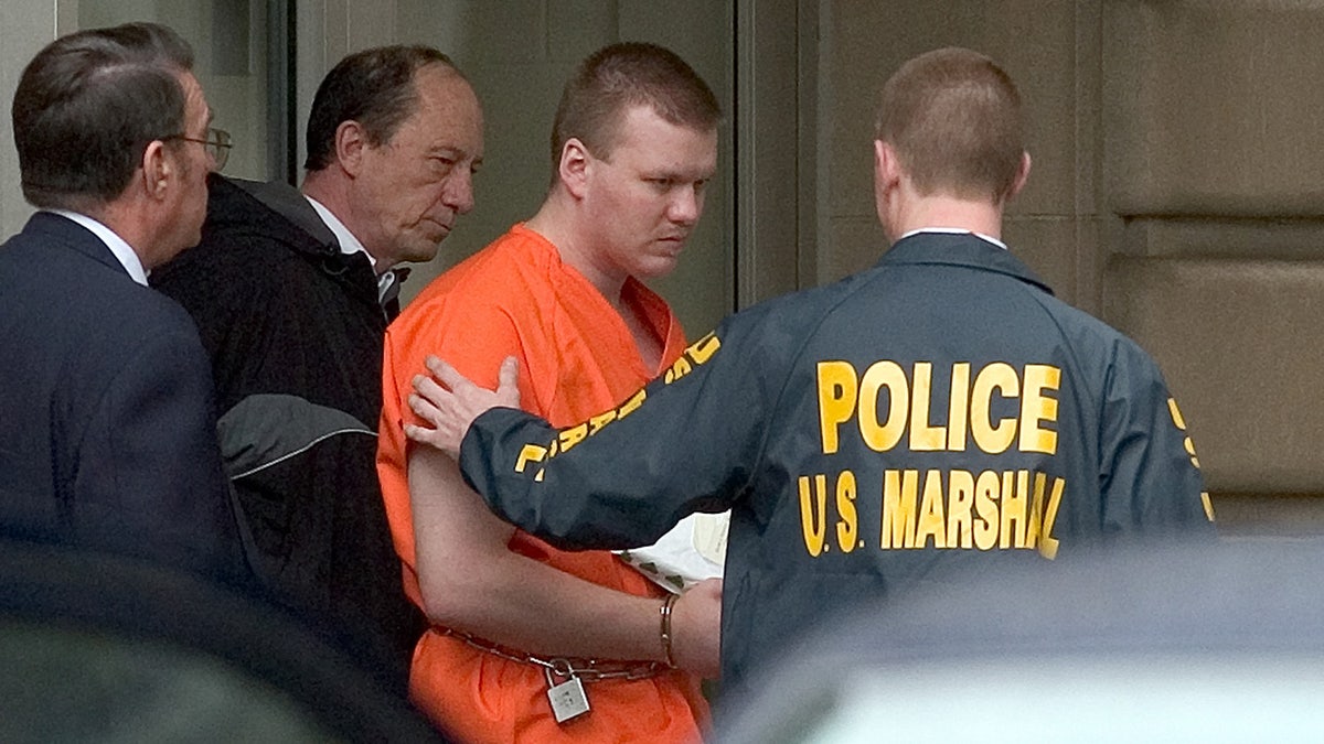 native Chadrick Fulks is escorted by U.S. Marshals out of the federal courthouse