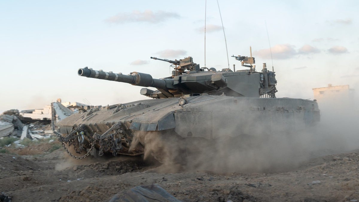 An IDF tank rolls through the Netzarim Corridor in Gaza.