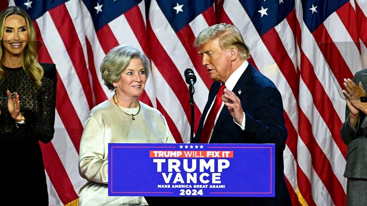 Former US President and Republican presidential candidate Donald Trump greets his campaign manager Susie Wiles (L) during an election night event at the West Palm Beach Convention Center in West Palm Beach, Florida, on November 6, 2024.