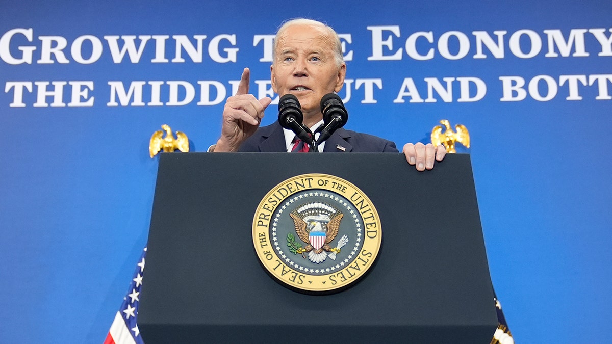 Joe Biden pointing at lectern