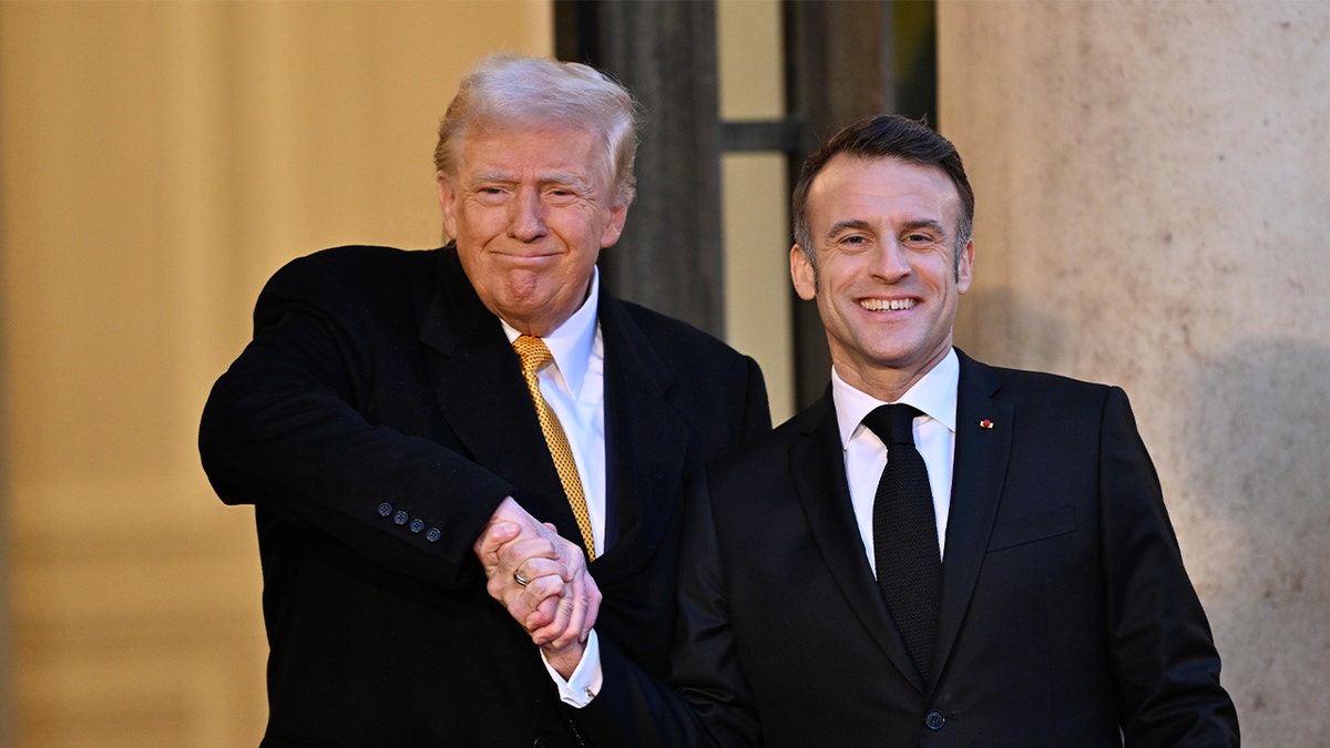 French President Emmanuel Macron, right, shakes hands as he welcomes President-elect Donald Trump before a meeting at the Elysee Presidential Palace in Paris on Dec. 7, 2024.