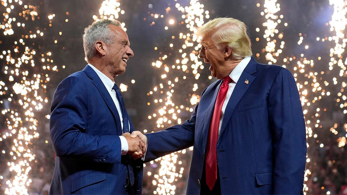 RFK Jr. and Trump with fireworks behind them