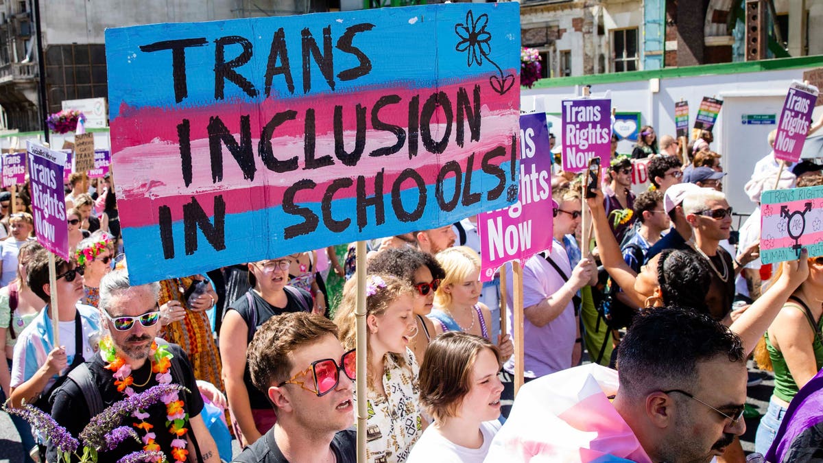 pro-transgender marchers with signs