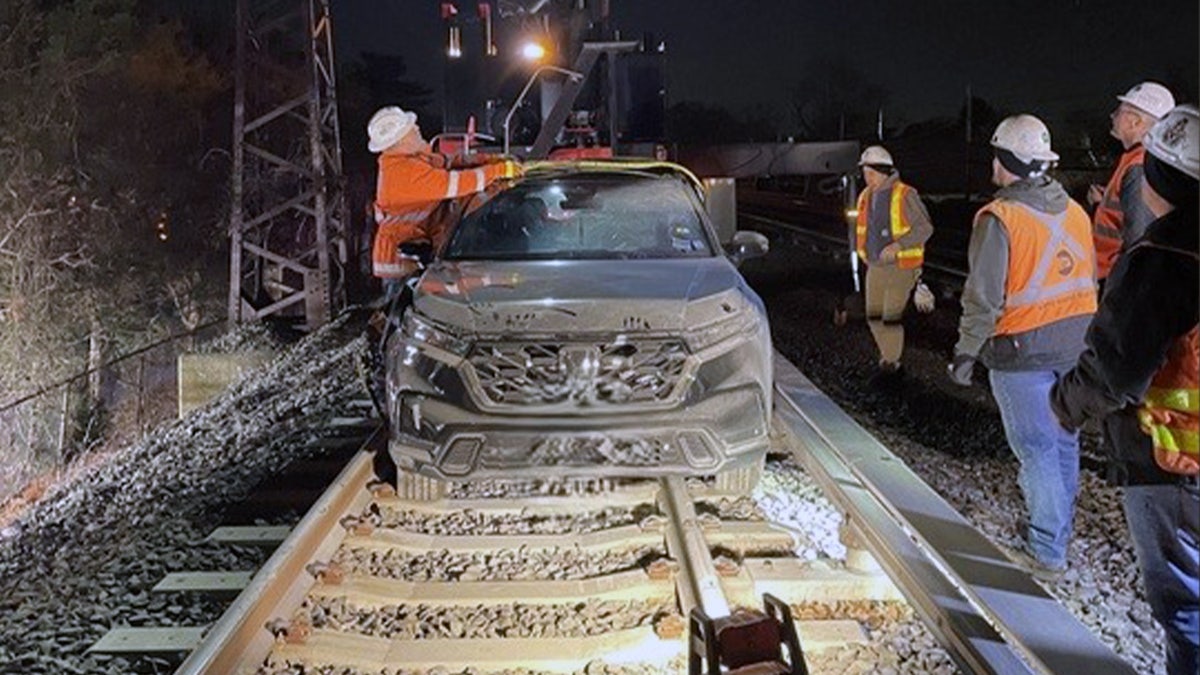 SUV on train tracks