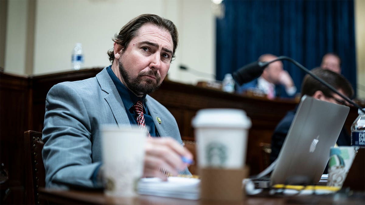 Rep. Eli Crane seated at table