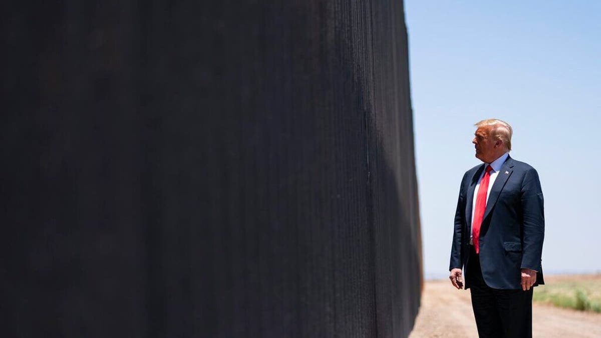 Then-President Trump tours a section of the border wall on Tuesday, June 23, 2020, in San Luis, Arizona.