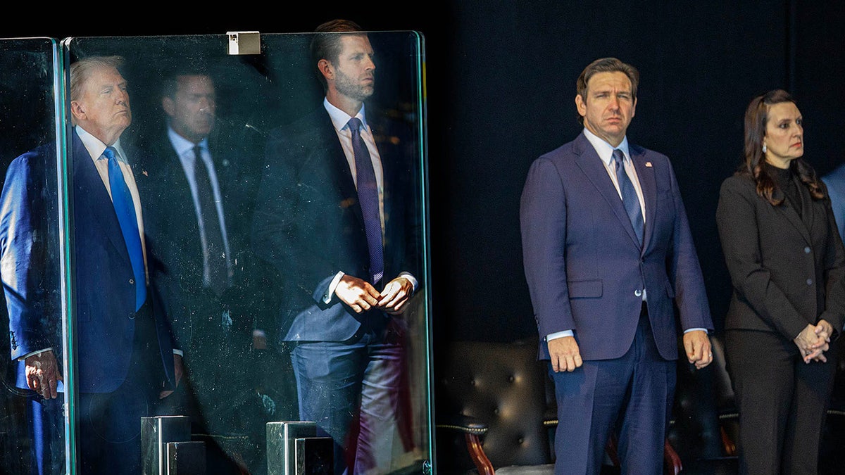 President Donald J. Trump, a secret service member, his son Donald Trump Jr., Florida Governor Ron DeSantis and his wife Casey DeSantis attend a memorial service for three fallen Palm Beach County Sheriff's deputies