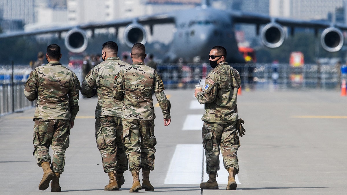 Military members walking at Seoul International Aerospace and Defense Exhibition